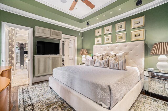 1634 Lenox Rd NE, Atlanta, GA 30306 - bedroom with ornamental molding, recessed lighting, a tray ceiling, and wood finished floors