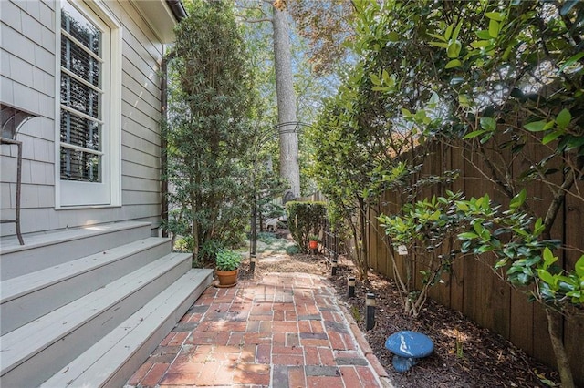 1634 Lenox Rd NE, Atlanta, GA 30306 - view of home's exterior featuring fence private yard, a patio, and entry steps