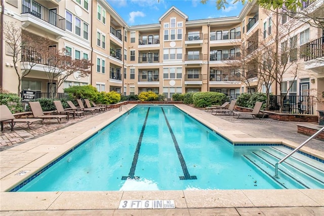 community pool featuring a patio area