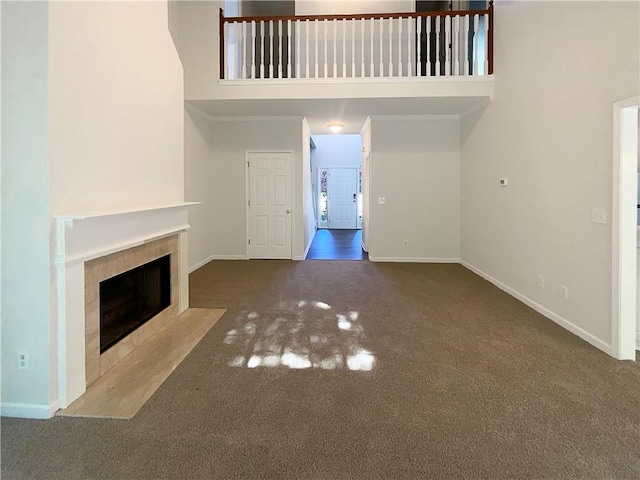 132 Lynnview Ct, Mcdonough, GA 30252 - unfurnished living room with carpet, a fireplace with flush hearth, and baseboards