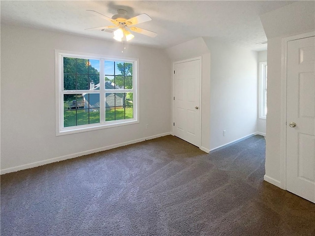 132 Lynnview Ct, Mcdonough, GA 30252 - spare room with dark carpet, a ceiling fan, and baseboards