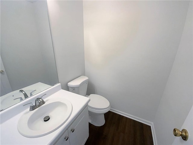 132 Lynnview Ct, Mcdonough, GA 30252 - bathroom featuring toilet, vanity, and wood finished floors
