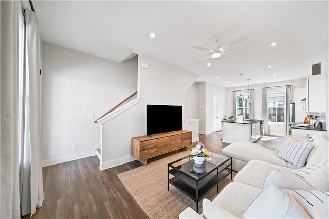 1247 Zucchini Cir SE, Atlanta, GA 30315 - living area with baseboards, dark wood-type flooring, ceiling fan, recessed lighting, and stairs