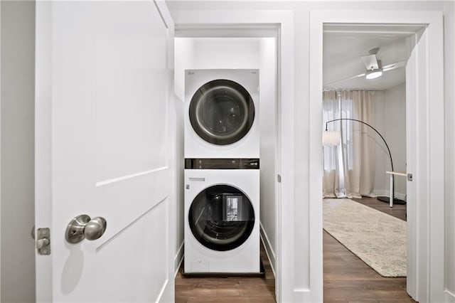 1247 Zucchini Cir SE, Atlanta, GA 30315 - laundry room with stacked washer / drying machine, wood finished floors, and baseboards