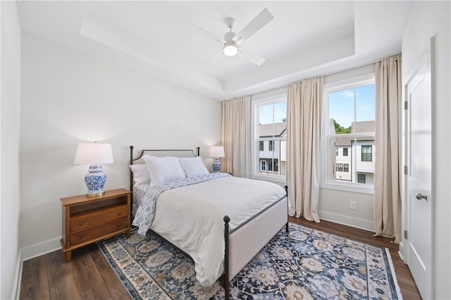 1247 Zucchini Cir SE, Atlanta, GA 30315 - bedroom featuring a raised ceiling, wood finished floors, baseboards, and ceiling fan