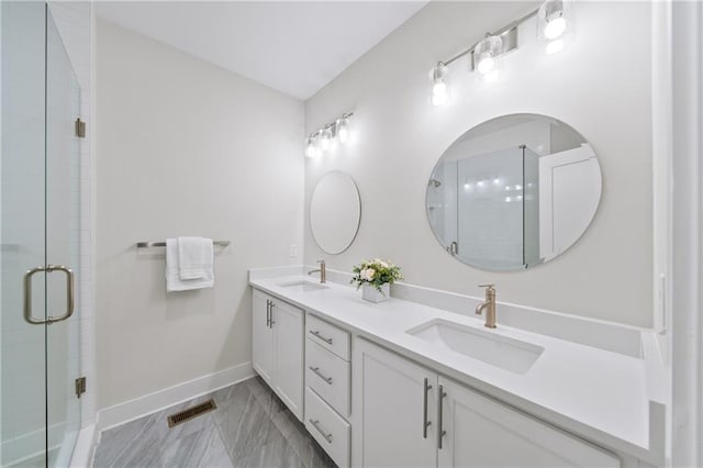 1247 Zucchini Cir SE, Atlanta, GA 30315 - bathroom featuring double vanity, baseboards, marble finish floors, and a shower stall