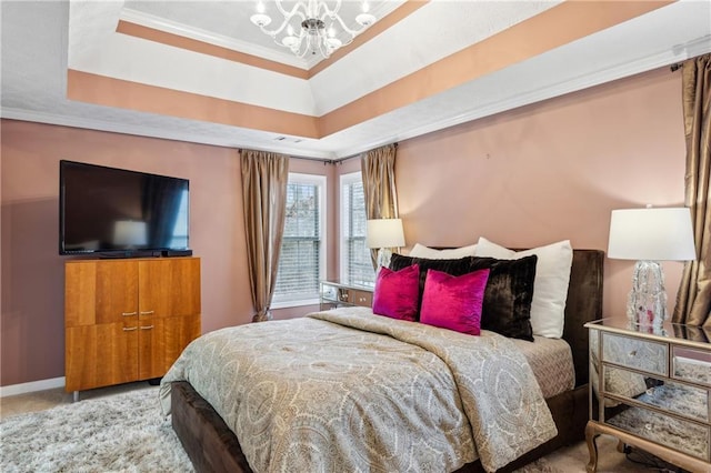 carpeted bedroom featuring a tray ceiling, baseboards, an inviting chandelier, and crown molding