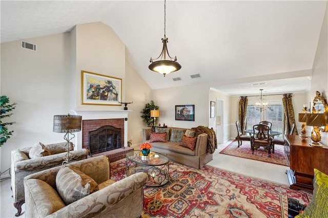 living room with high vaulted ceiling, a notable chandelier, and a fireplace