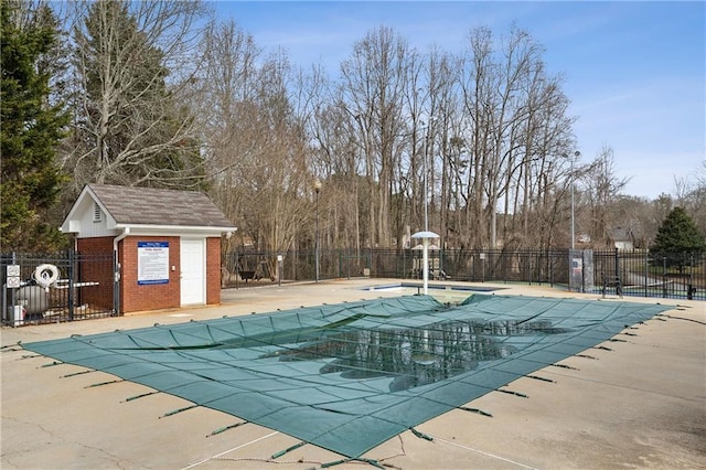 pool featuring a patio area and fence