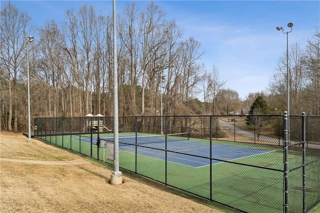 view of sport court with fence