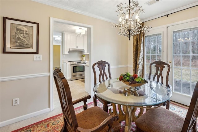dining room featuring baseboards, visible vents, light carpet, crown molding, and a chandelier