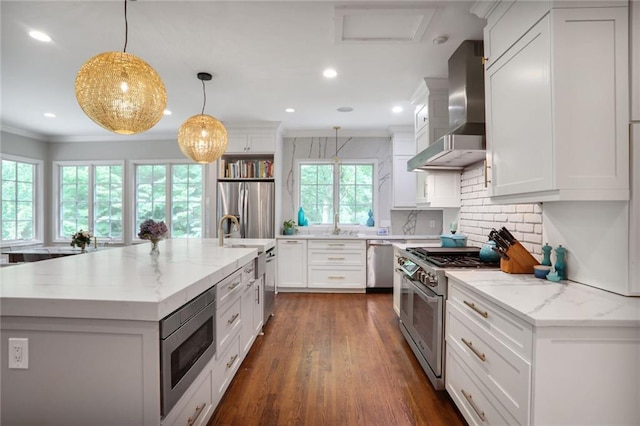 377 Camden Rd NE, Atlanta, GA 30309 - kitchen featuring wall chimney range hood, appliances with stainless steel finishes, crown molding, recessed lighting, and backsplash