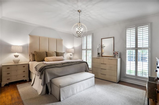 377 Camden Rd NE, Atlanta, GA 30309 - bedroom with crown molding, multiple windows, wood finished floors, and a chandelier
