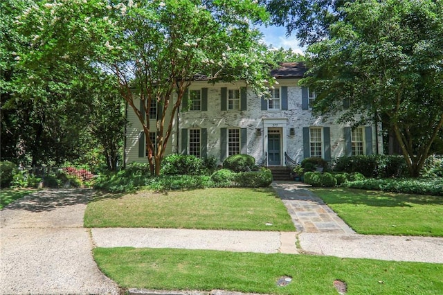 377 Camden Rd NE, Atlanta, GA 30309 - colonial home featuring a front lawn