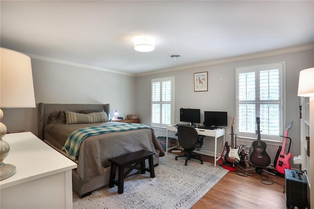 377 Camden Rd NE, Atlanta, GA 30309 - bedroom featuring a desk, crown molding, and light wood-style floors