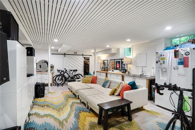 377 Camden Rd NE, Atlanta, GA 30309 - living area with a barn door and recessed lighting