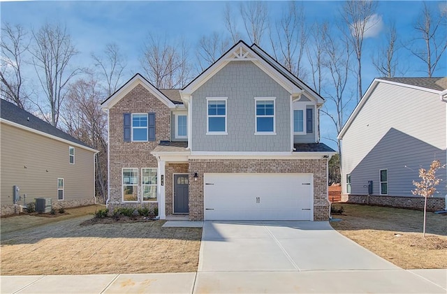 craftsman inspired home featuring a garage, cooling unit, concrete driveway, and brick siding