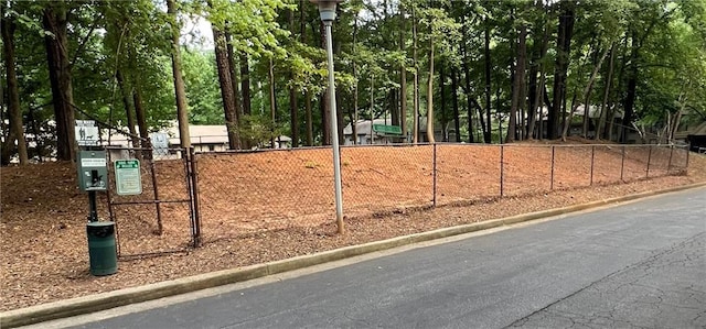 view of property's community featuring fence