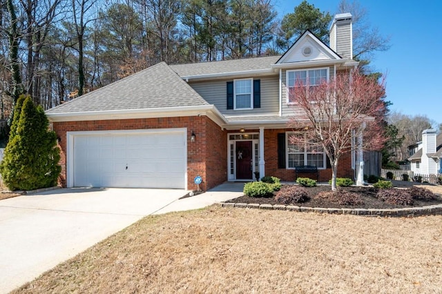 traditional-style house with driveway, an attached garage, a shingled roof, a chimney, and brick siding