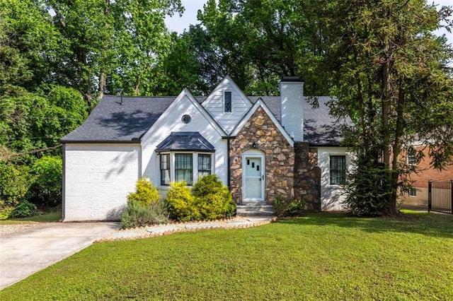 1334 Milton Pl SE, Atlanta, GA 30316 - view of front facade with stone siding, a chimney, and a front yard