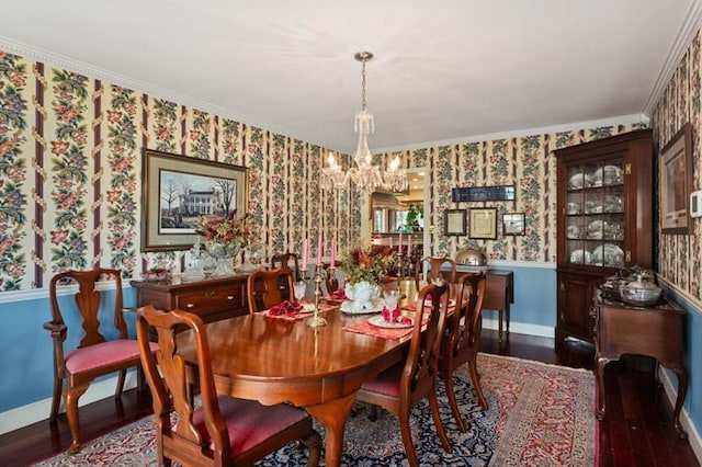 dining space featuring an inviting chandelier, dark hardwood / wood-style floors, and crown molding