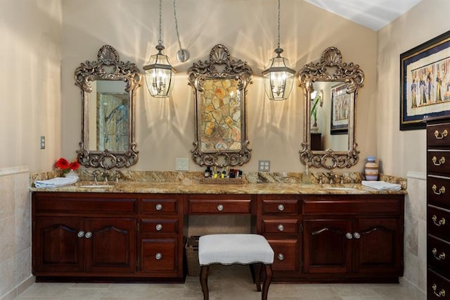 bathroom with tile walls and vanity