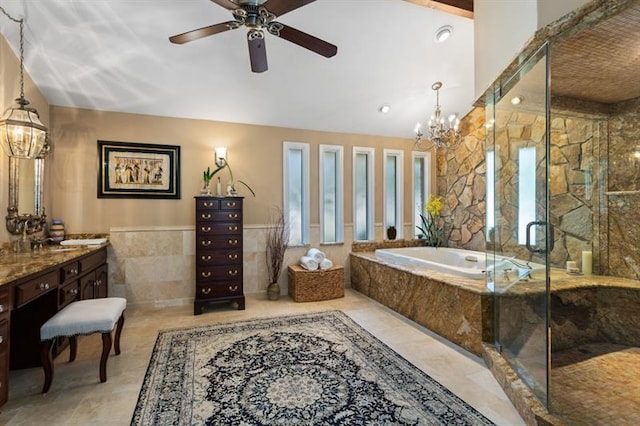 bathroom featuring vanity, a chandelier, and plus walk in shower