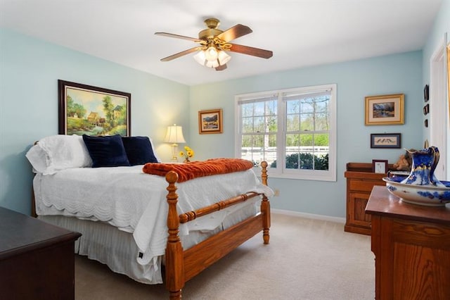 bedroom with light colored carpet and ceiling fan