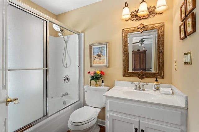 full bathroom with vanity, toilet, and combined bath / shower with glass door