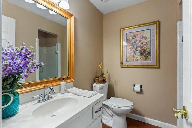 bathroom featuring toilet and vanity