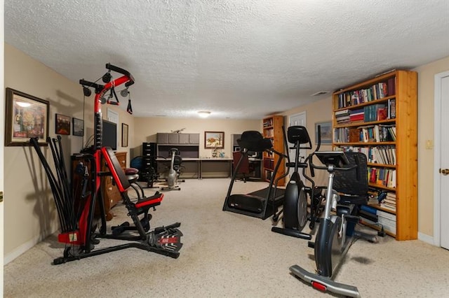 workout area with a textured ceiling