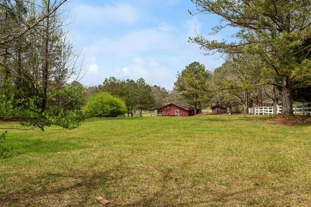 view of yard with a rural view