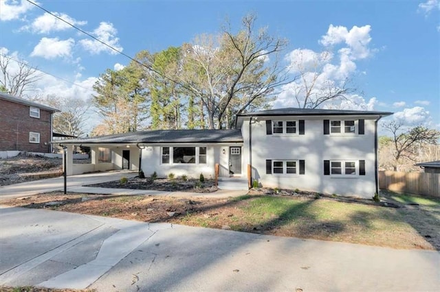 view of front of property featuring a carport