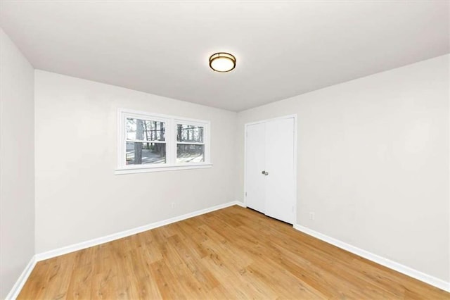 unfurnished room featuring wood-type flooring