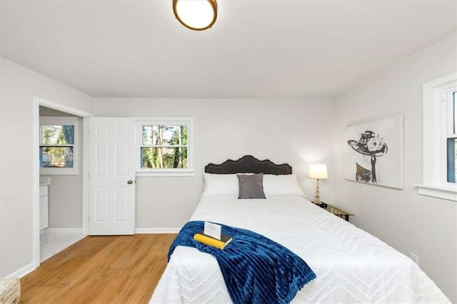 bedroom with wood-type flooring