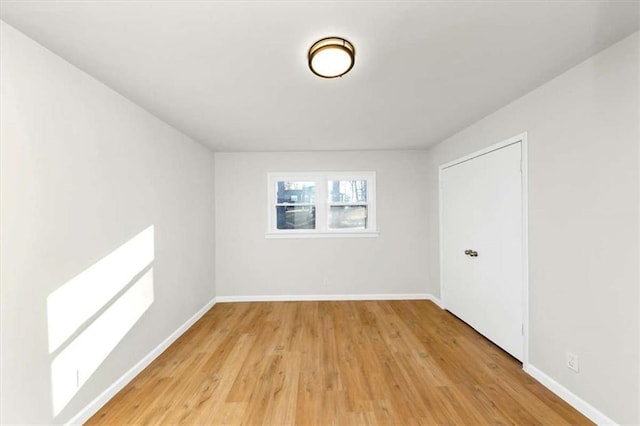 bonus room with light wood-type flooring