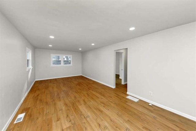 spare room with light wood-type flooring