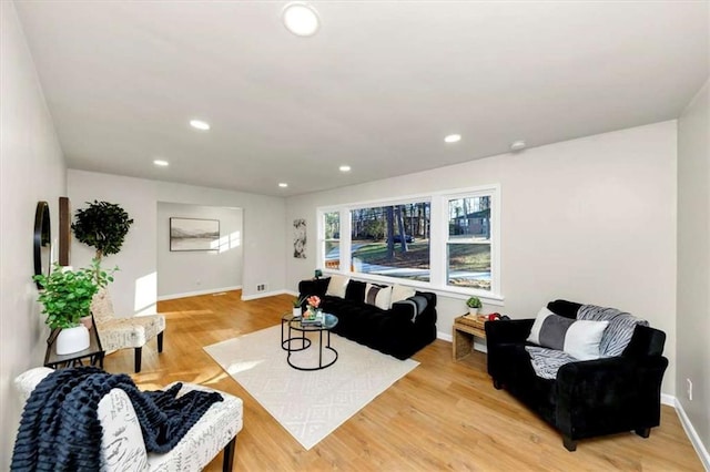 living room with light hardwood / wood-style floors