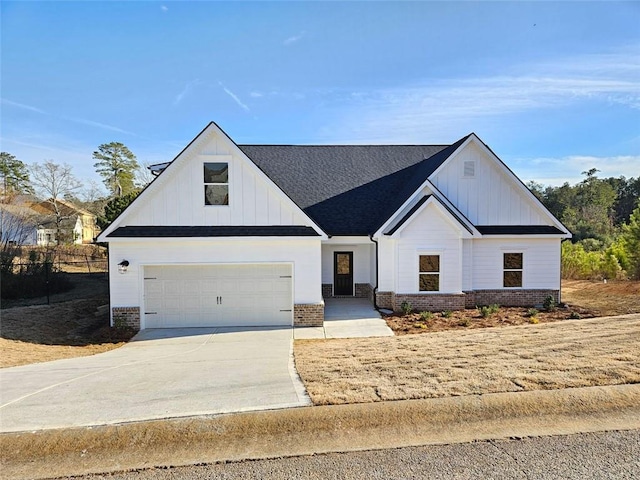 228 Trellis Walk, Macon, GA 31220 - modern farmhouse featuring brick siding, concrete driveway, board and batten siding, and a garage