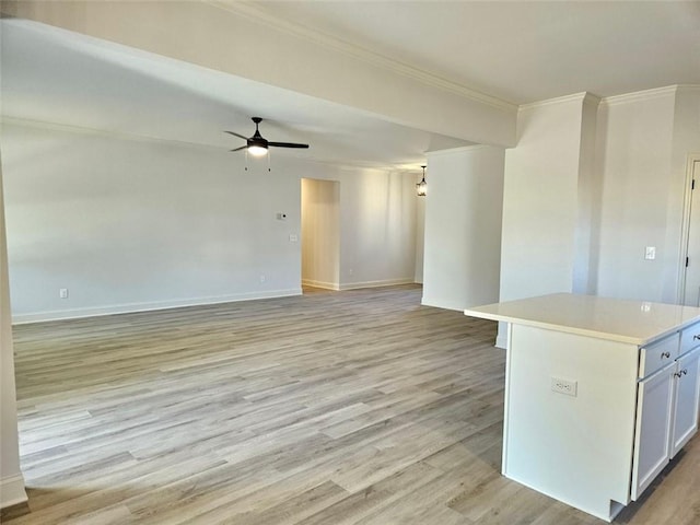 228 Trellis Walk, Macon, GA 31220 - unfurnished living room featuring crown molding, a ceiling fan, light wood-style flooring, and baseboards
