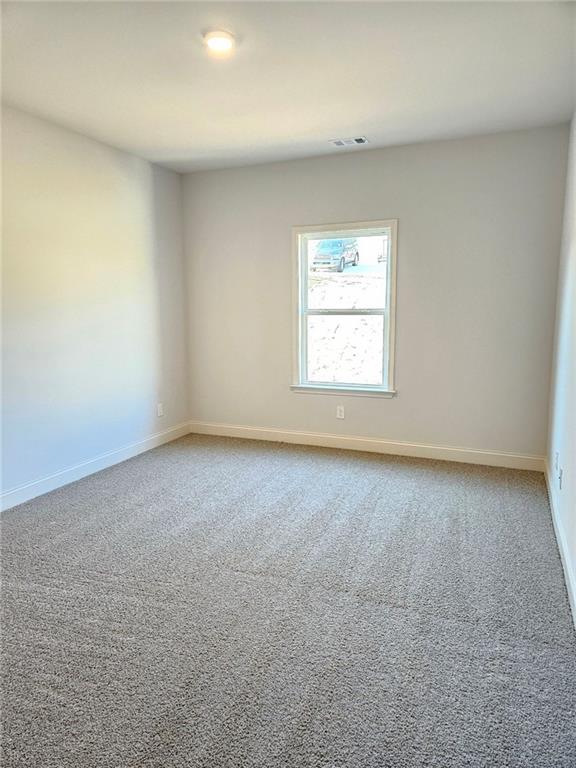 228 Trellis Walk, Macon, GA 31220 - carpeted spare room with baseboards