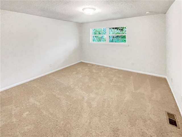6354 Shannon Pkwy Unit 8B, Union City, GA 30291 - spare room with a textured ceiling and carpet flooring