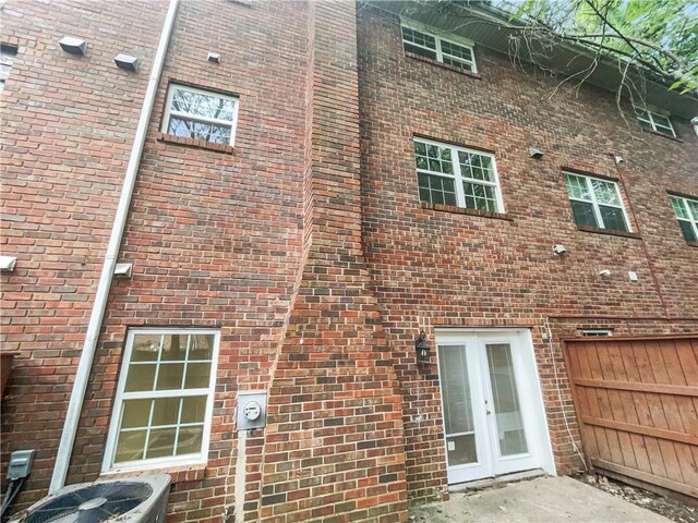 6354 Shannon Pkwy Unit 8B, Union City, GA 30291 - view of side of property featuring french doors and brick siding