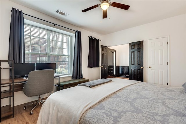 bedroom with ceiling fan and light wood-type flooring