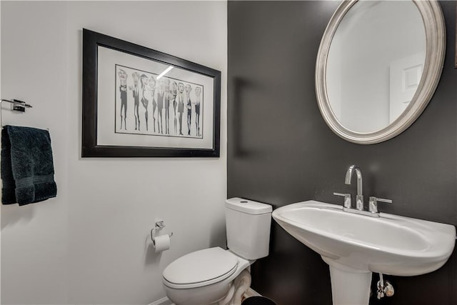 bathroom featuring sink and toilet