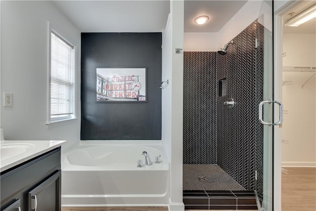 bathroom with vanity, separate shower and tub, and wood-type flooring