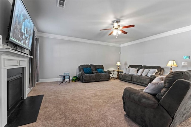 living room featuring carpet, ceiling fan, and ornamental molding