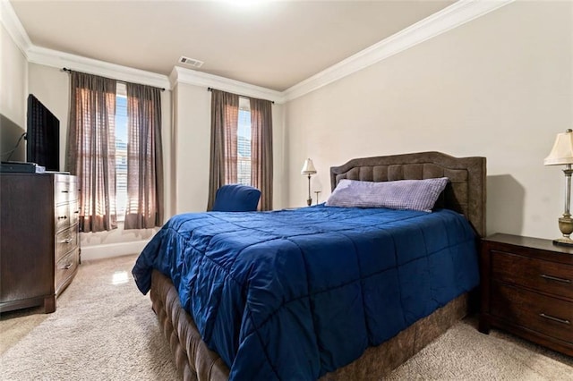 bedroom featuring ornamental molding and light colored carpet