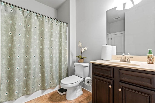 bathroom with tile patterned floors, toilet, and vanity