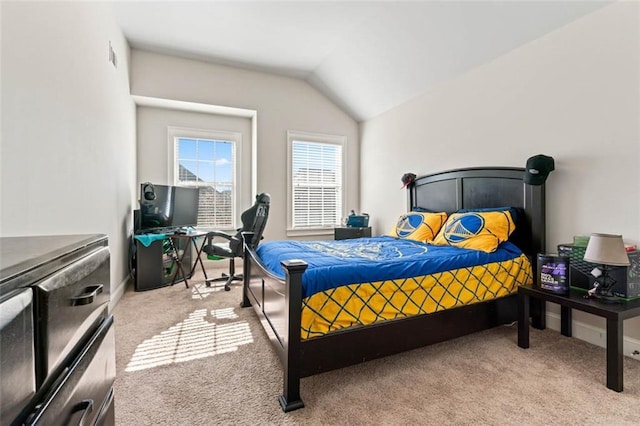 bedroom with light colored carpet and vaulted ceiling